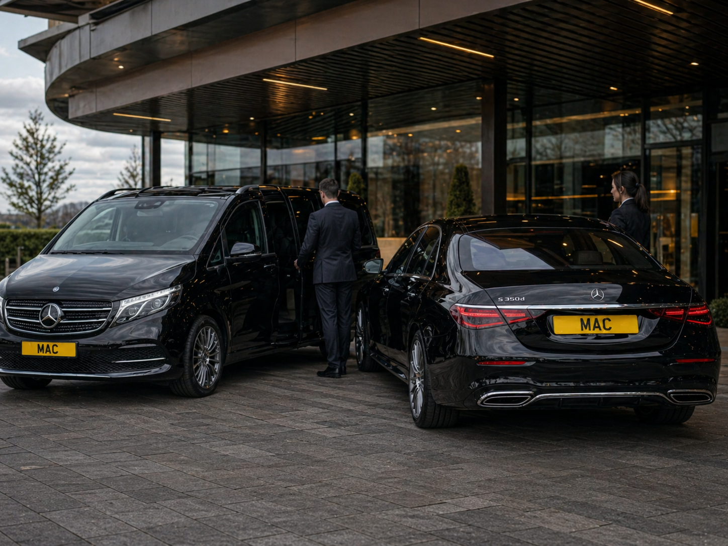 Mercedes hourly chauffeur hire Manchester Airport with black MAC number plate vehicles outside a premium airport hotel for passengers, families and corporate travellers