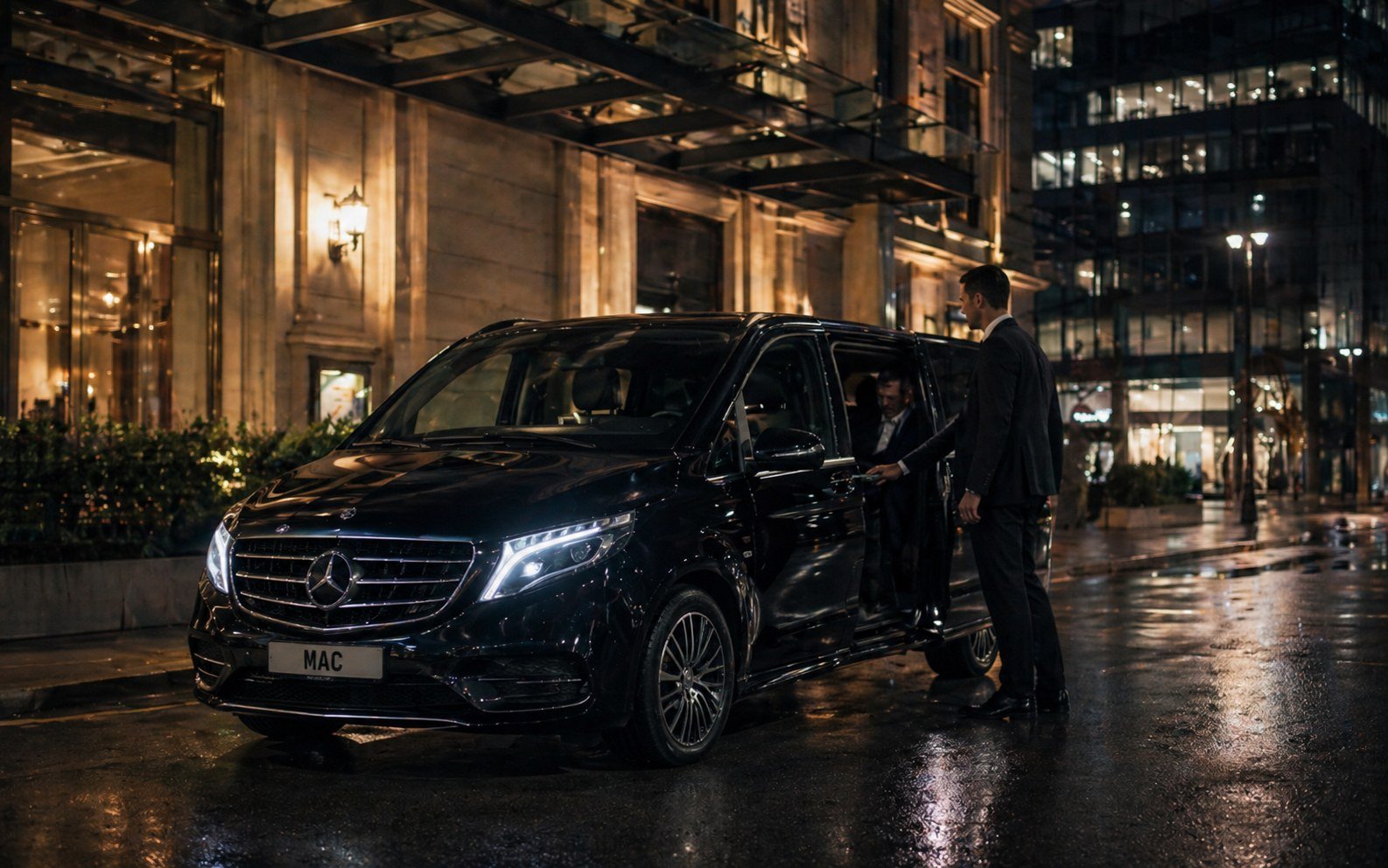 Private city to city chauffeur travel with a Mercedes vehicle at night