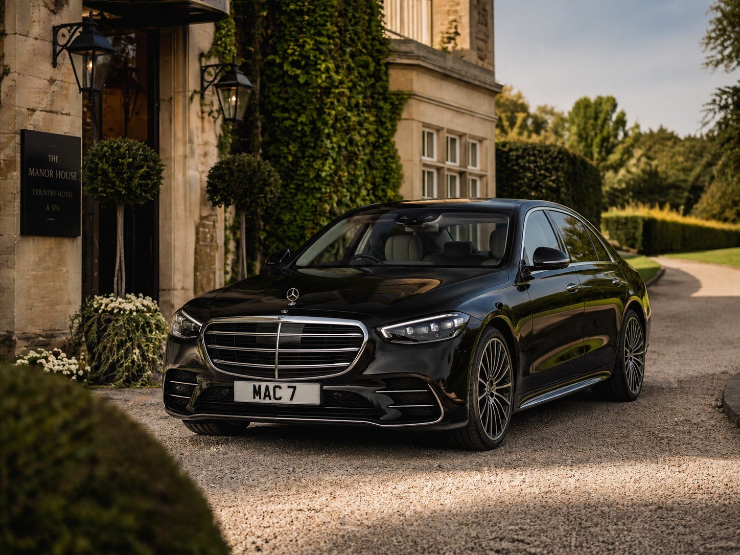 Multi-Day Chauffeur Hire with a black Mercedes S-Class outside a luxury countryside hotel during a UK touring itinerary