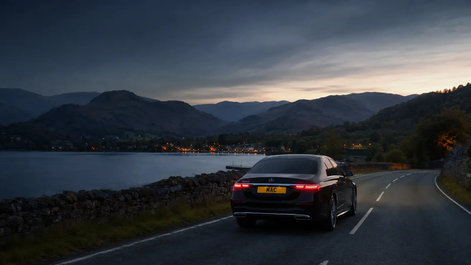 Black MAC Mercedes travelling through Lake District at dusk